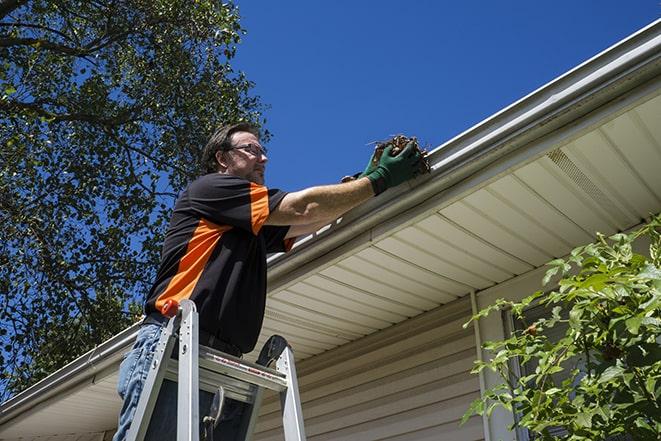 rain gutter being fixed to prevent water leakage in Carson